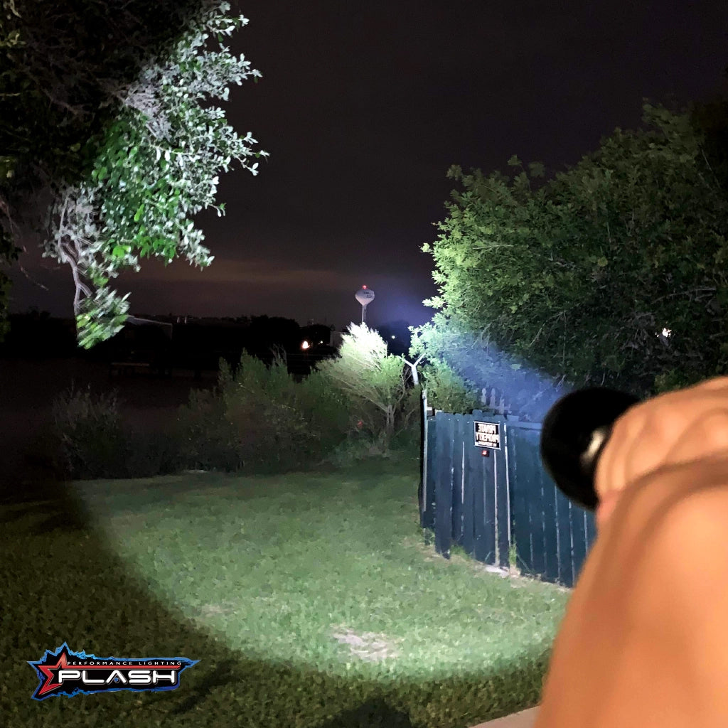 PL25X compact rechargeable LED flashlight in use at night by Plash