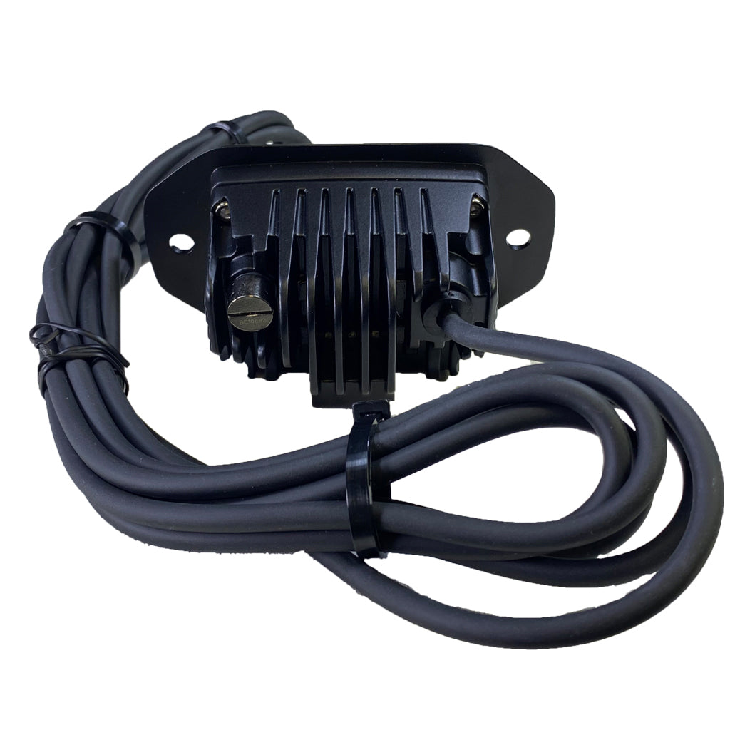 Black LED flush mounted low profile light with diffused lens and 'PLASH' branding on a white background top view with wire.