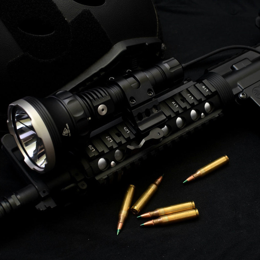 PL50X flashlight mounted on rifle with gun mount