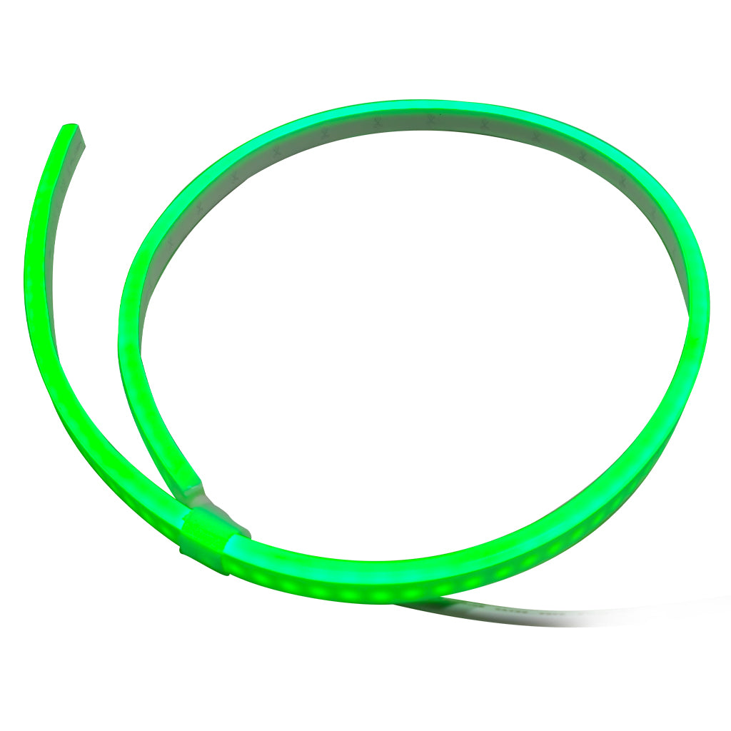 A flexible green LED light strip coiled in a large circle on a plain white background.