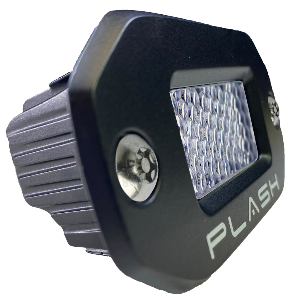 Black LED flush mounted low profile light with diffused lens and 'PLASH' branding on a white background from a three quarter view.
