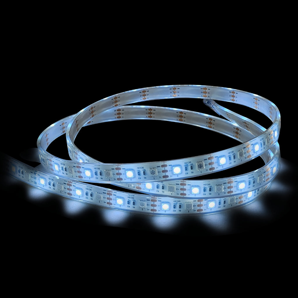 A flexible LED light strip coiled on a black background, illuminated with a cool white glow.